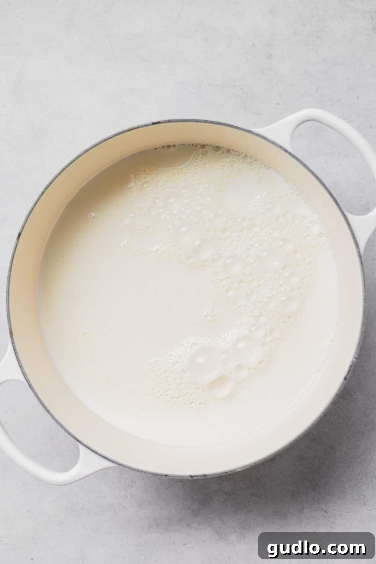 Delicious homemade ricotta cheese is made with just 4 ingredients and in less than an hour! Delicate curds and golden whey separate in a saucepan, signaling the formation of fresh ricotta cheese.