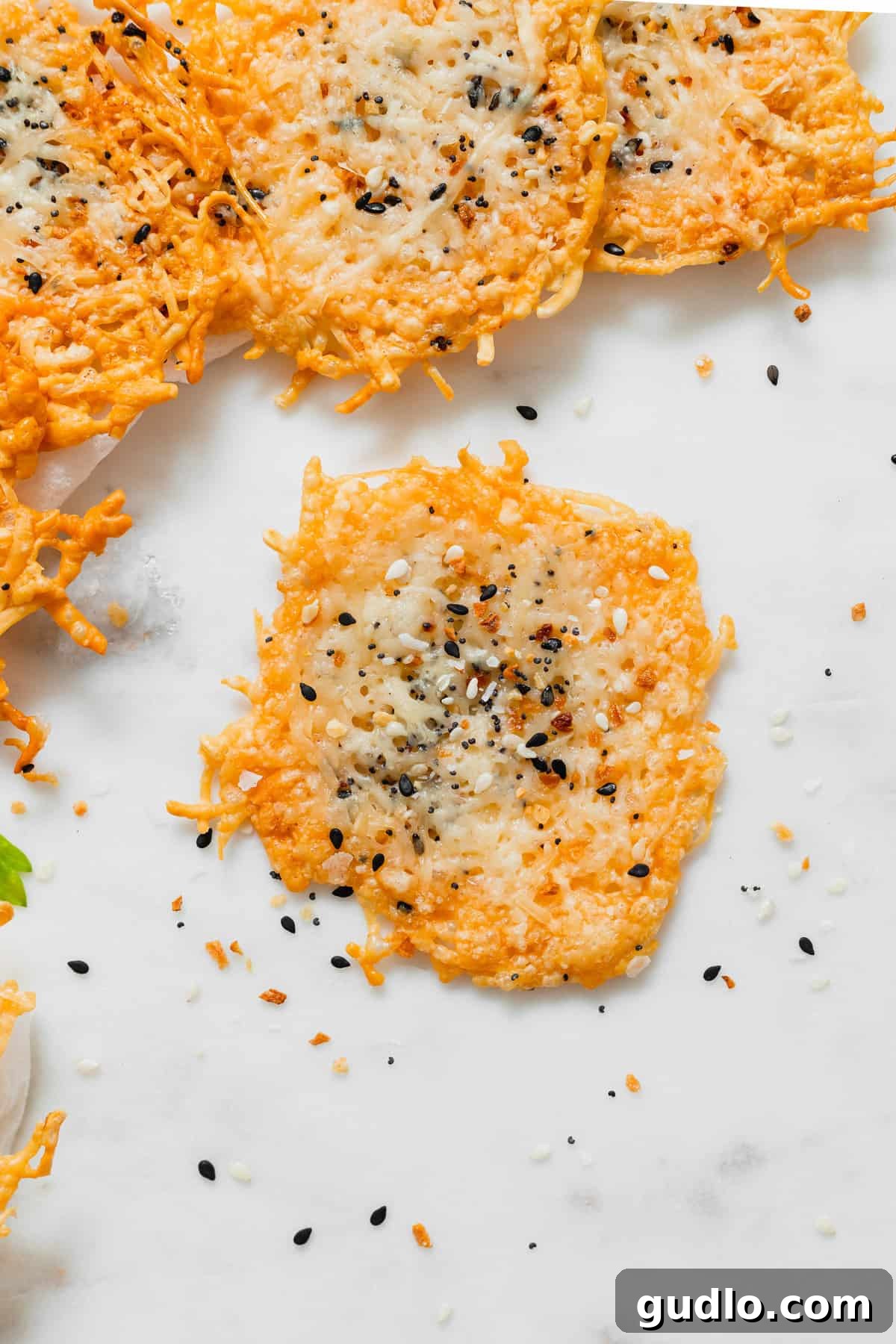 A beautifully composed shot of freshly made parmesan cheese crisps, emphasizing their inviting texture and delicious potential.