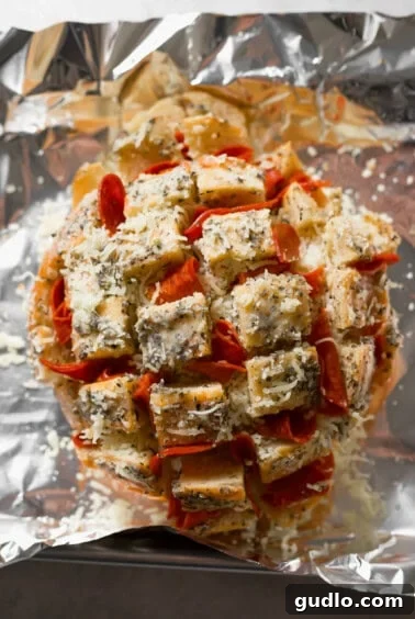 Stuffing the bread with cheese and pepperoni