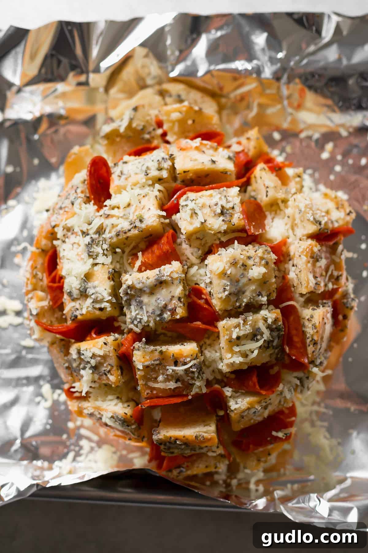 A bread loaf generously stuffed with pepperoni and shredded mozzarella cheese