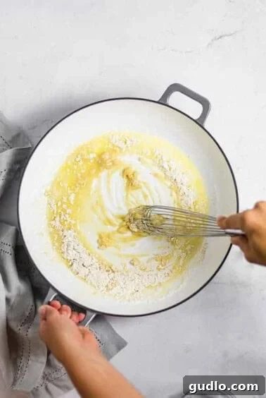 The Definitive Mac and Cheese Sauce 8 Whisking butter and flour for the roux.