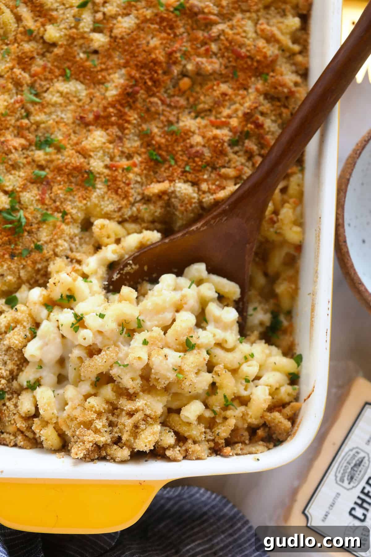 Experience the best Baked Mac and Cheese – creamy, flavorful, and crowned with a delicious breadcrumb topping. baked mac and cheese in a casserole dish, topped with golden breadcrumbs