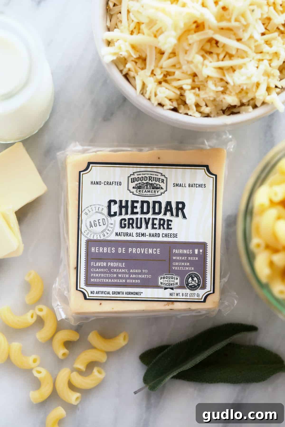 Unlock amazing flavor in your baked mac and cheese by using the right cheese, like this Wood River Creamery block. block of wood river creamery cheese ready to be shredded for baked mac and cheese
