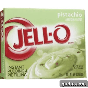 Mini Pistachio Delights 2 A box of pistachio Jell-O pudding mix on a white background, highlighting the key ingredient.