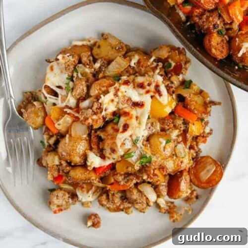 Sizzling Skillet Breakfast Potatoes 8 A plate of delicious meat and vegetable casserole, also known as skillet breakfast potatoes.