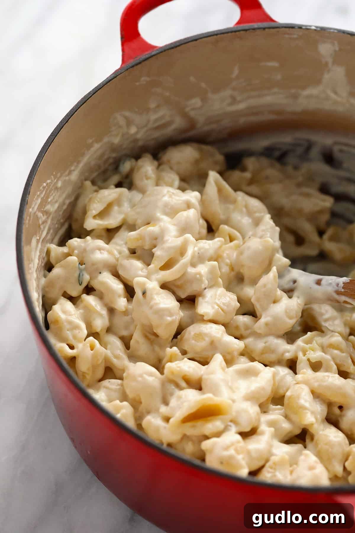 Brie Mac and Cheese served in a ceramic casserole dish, ready to be enjoyed.