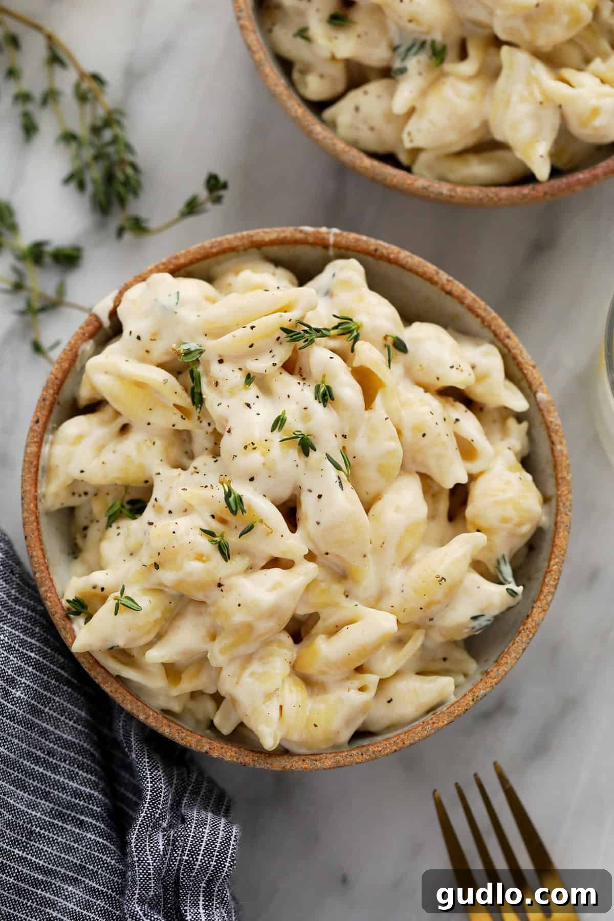 A serving of creamy Brie mac and cheese in a rustic bowl, ready to be enjoyed.