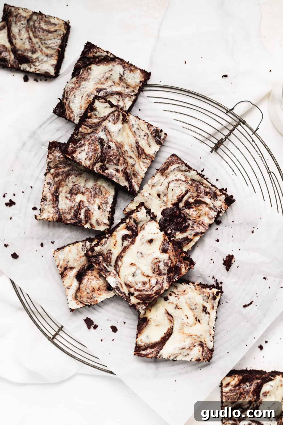 Decadent Cream Cheese Swirl Brownies 6 Cream cheese brownies cooling on a wire rack, perfectly baked.