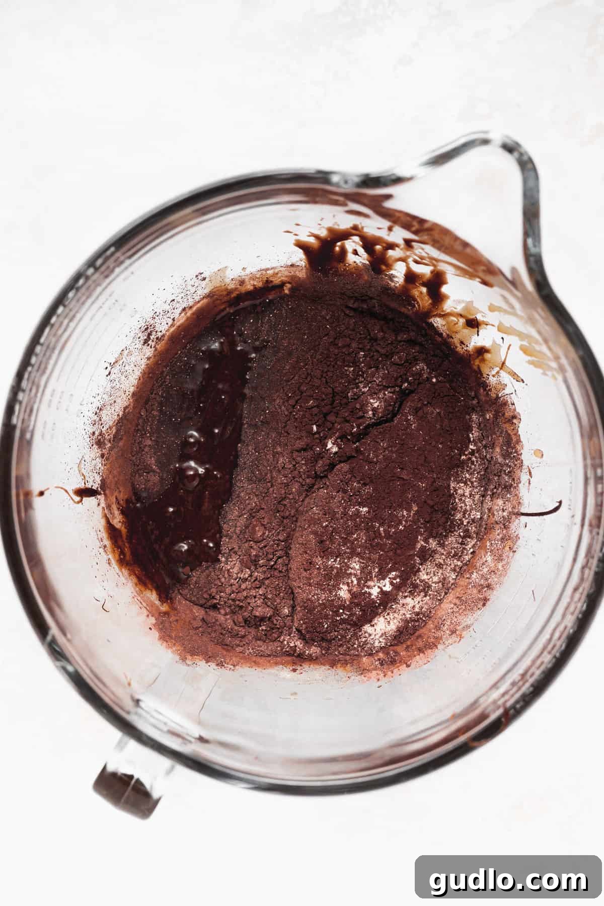 Decadent Cream Cheese Swirl Brownies 4 Rich chocolate brownie batter in a mixing bowl, ready for baking.