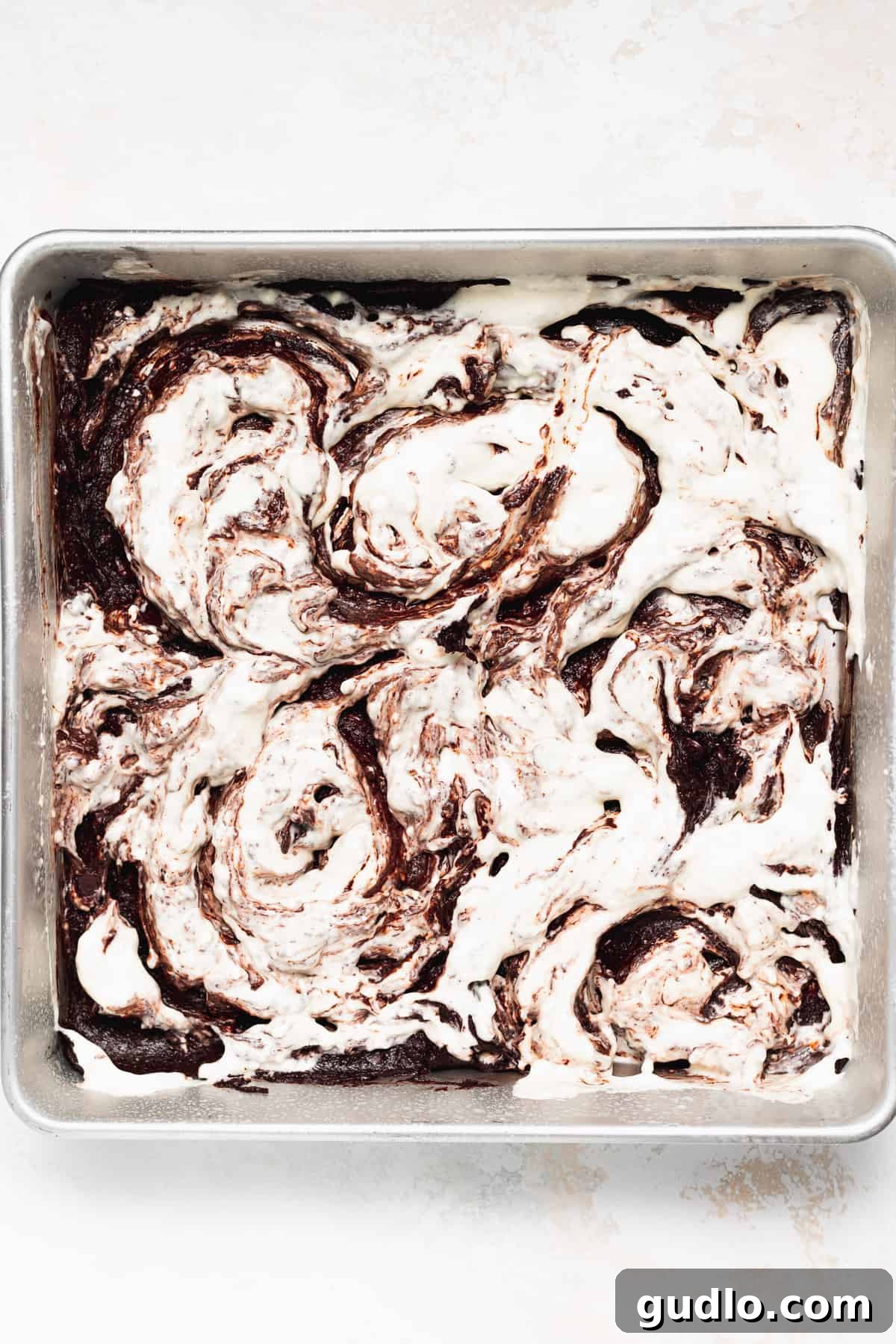 Decadent Cream Cheese Swirl Brownies 5 Cream cheese swirl artfully applied on top of the brownie batter.