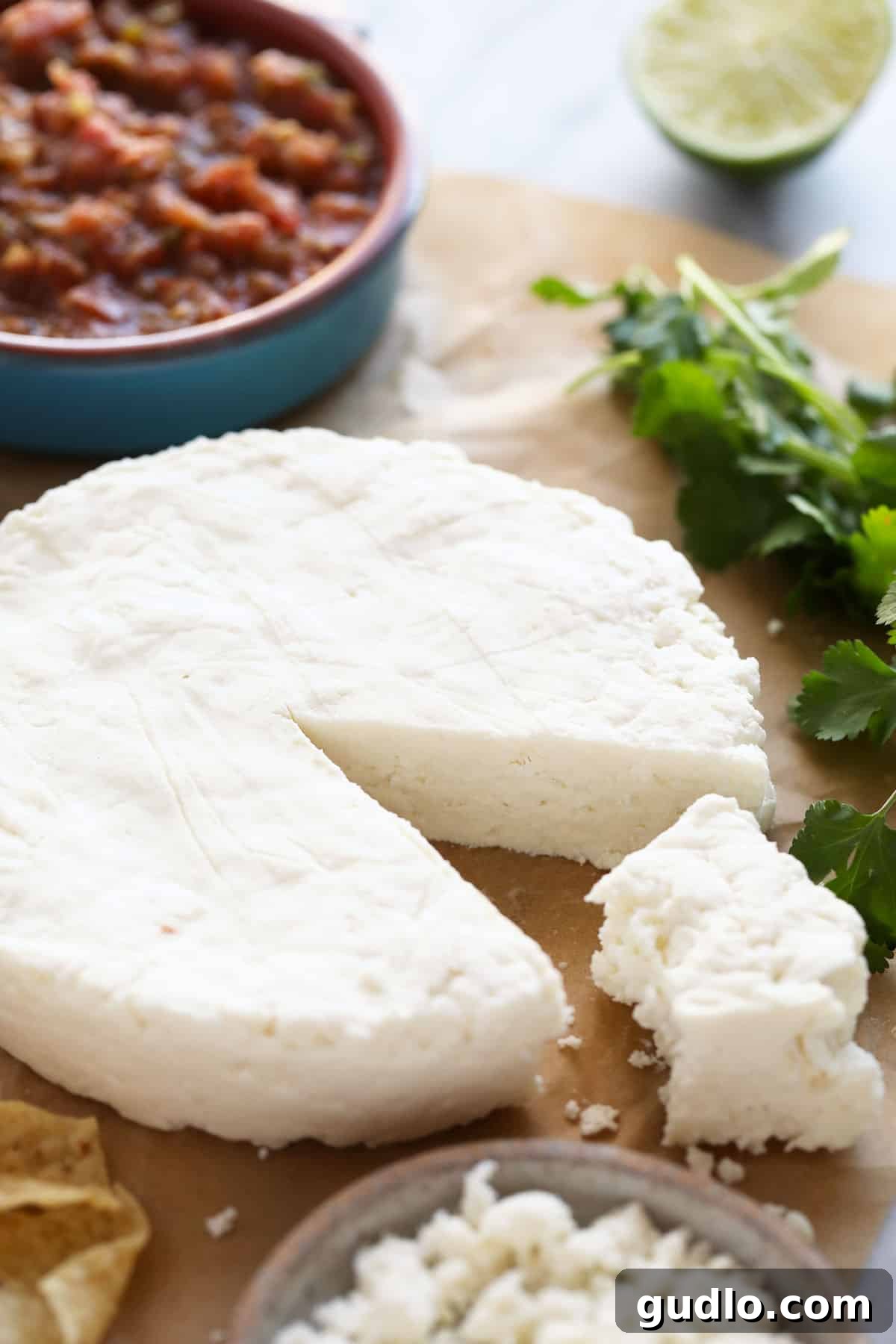 The Art of Making Queso Fresco at Home 11 A large chunk of homemade queso fresco, showcasing its texture.