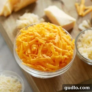 Close-up of freshly grated cheese, perfect for making creamy sauces.
