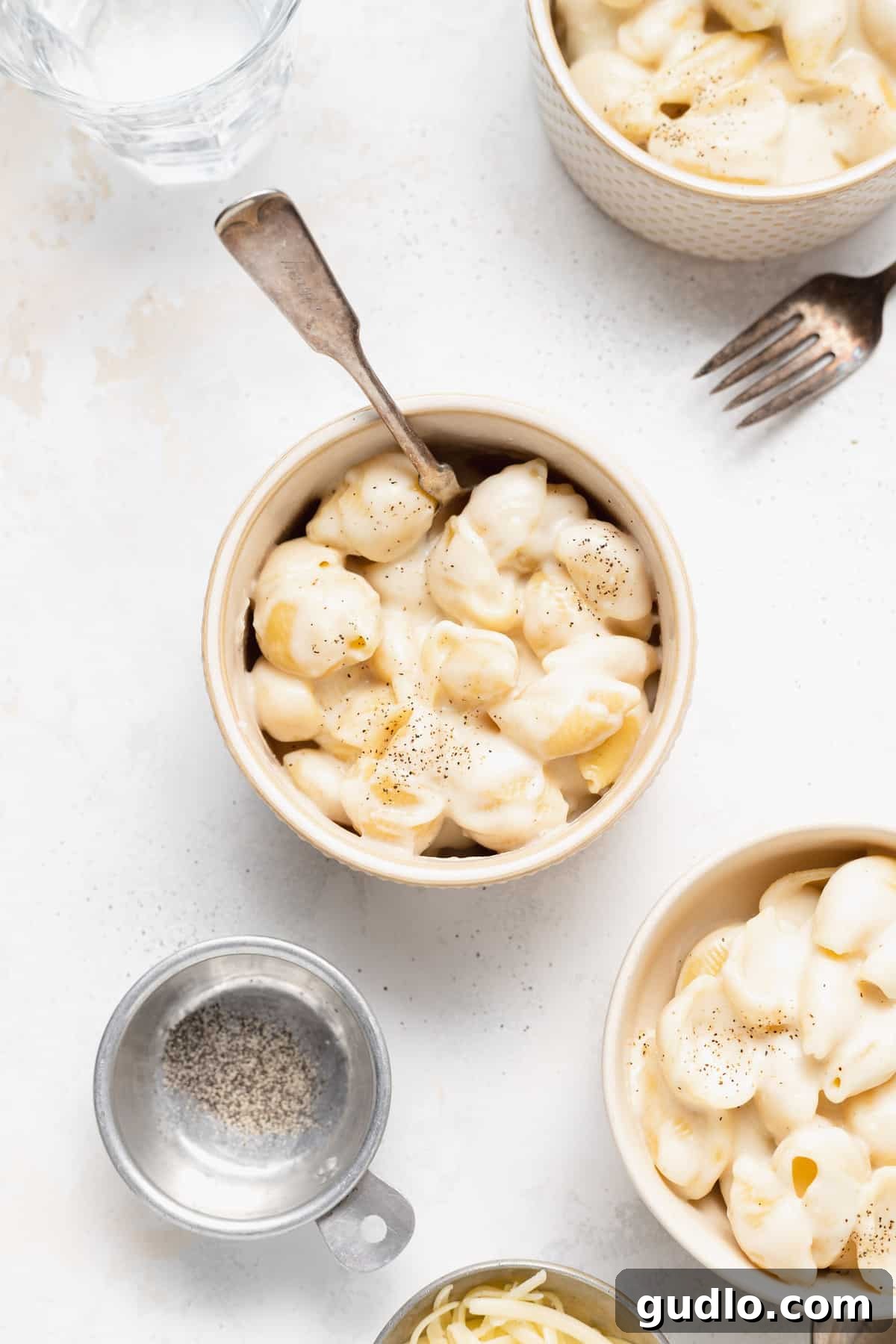 A beautifully presented bowl of white cheddar mac and cheese, showcasing its creamy texture.