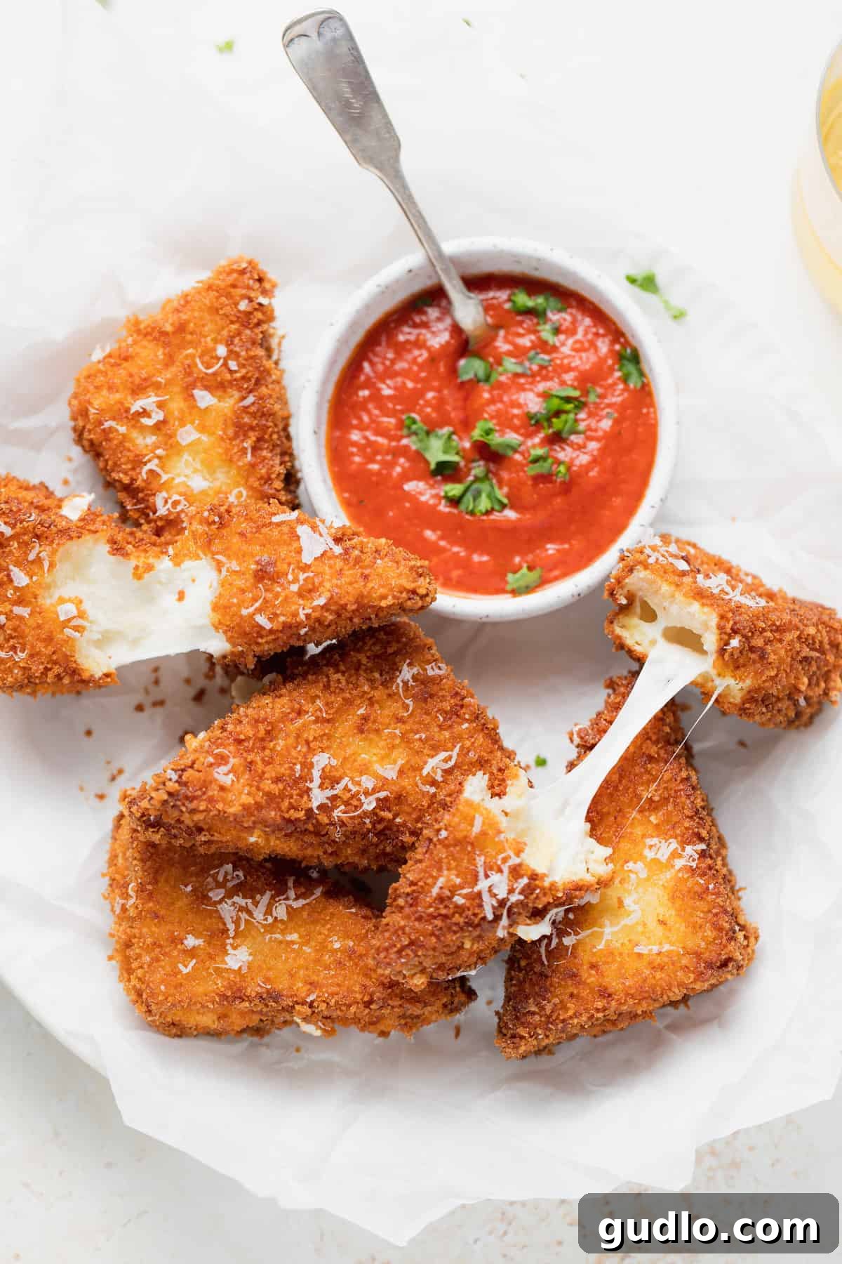 Crispy Mozzarella in Carrozza served with warm marinara sauce Golden brown Mozzarella in Carrozza sandwiches with marinara dipping sauce