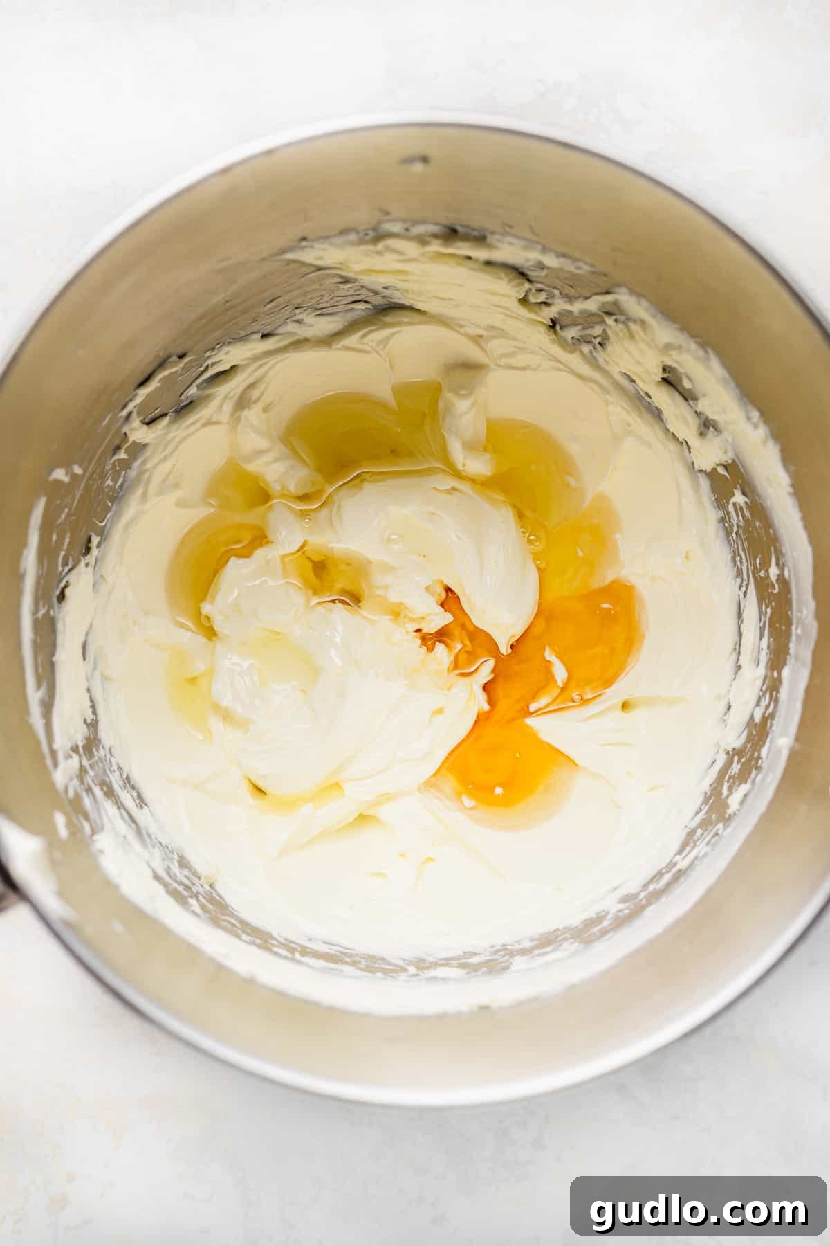 Essential ingredients for a creamy no-bake cream cheese lemonade pie neatly arranged in a bowl, ready for mixing.