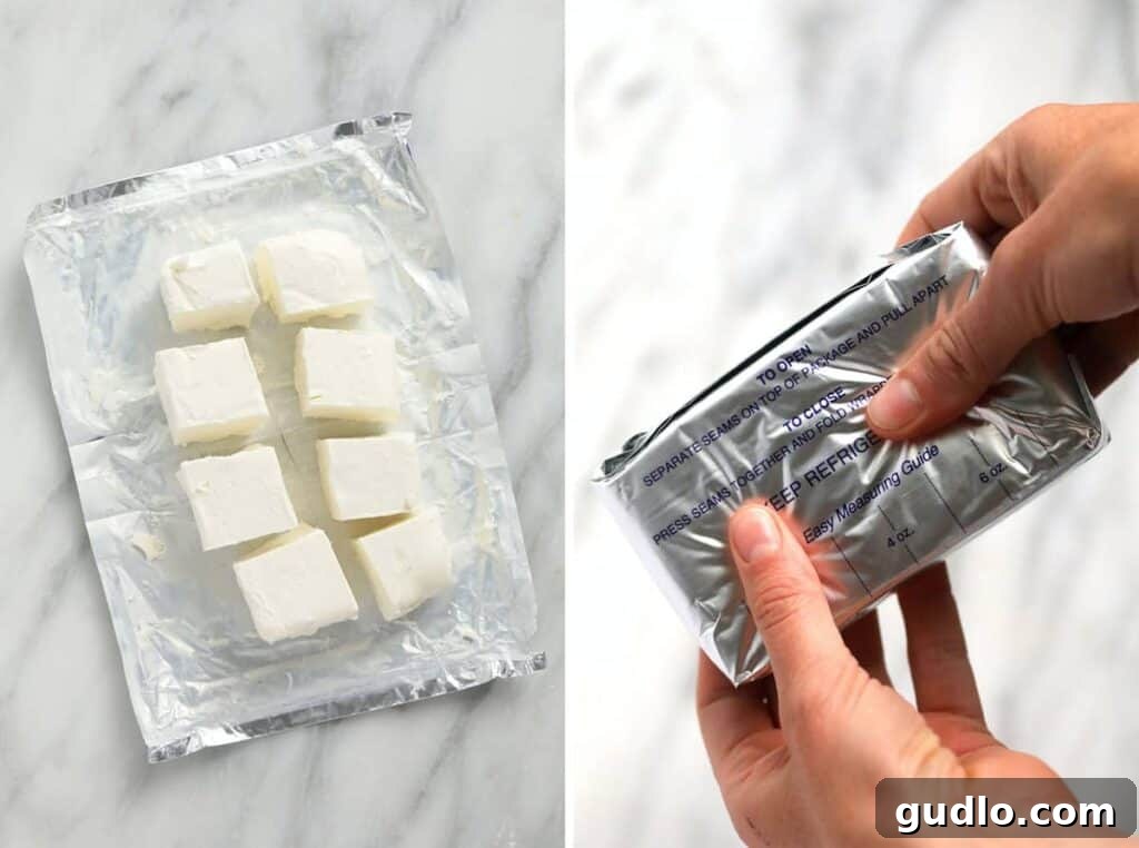 A block of softened cream cheese ready for use, illustrating the perfect texture for blending into desserts.