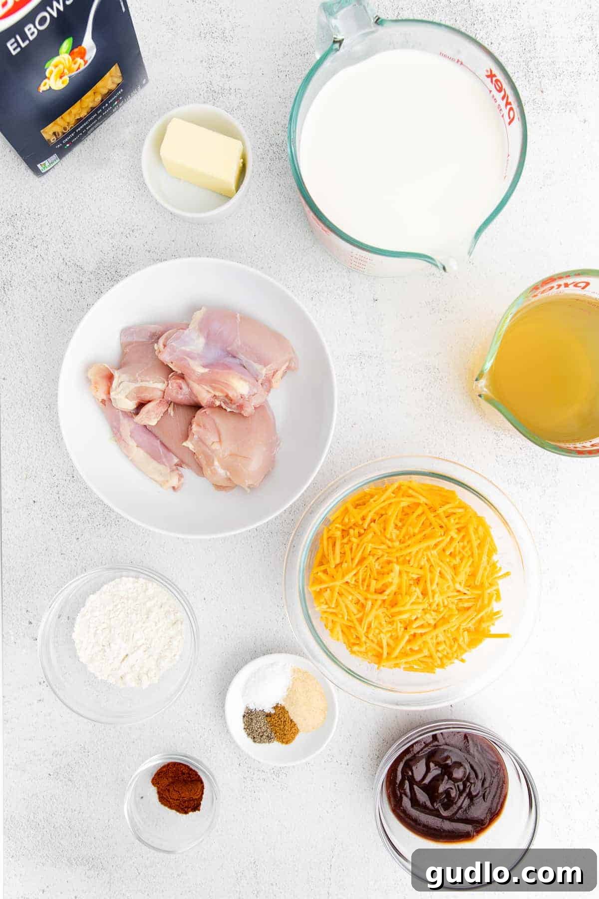 All of the fresh ingredients for BBQ Chicken Mac and Cheese laid out on a clean surface.