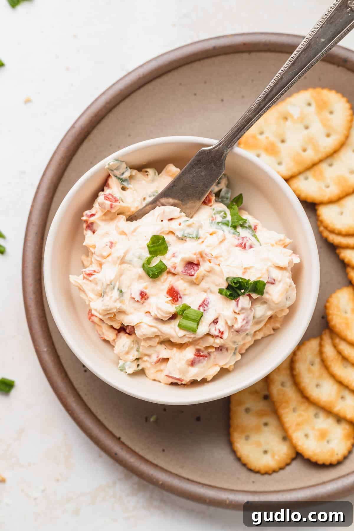 Make your own homemade pimento cheese for a decadent spread or easy dip for crackers. Enjoy! pimento cheese dip in bowl