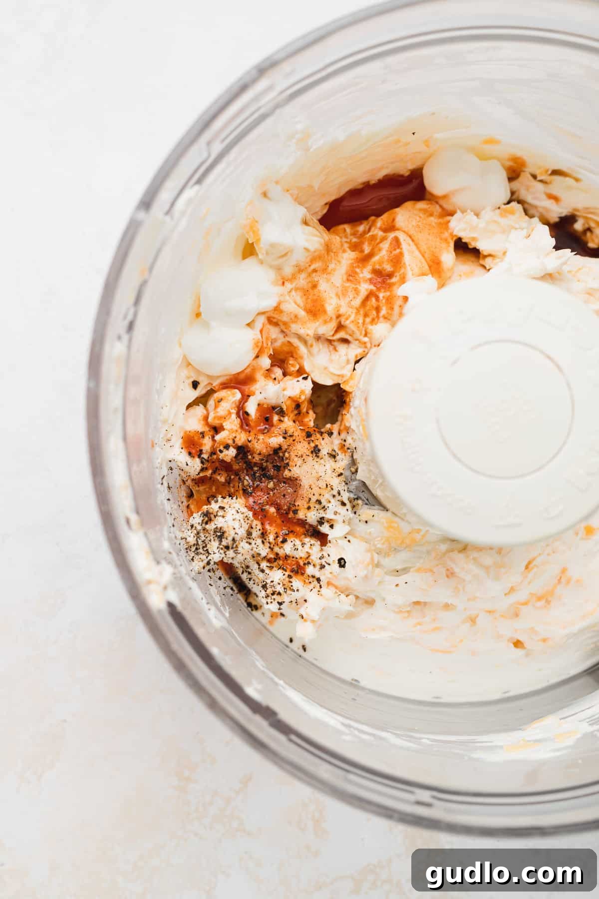 Make your own homemade pimento cheese for a decadent spread or easy dip for crackers. Enjoy! mixing pimento cheese in food processor