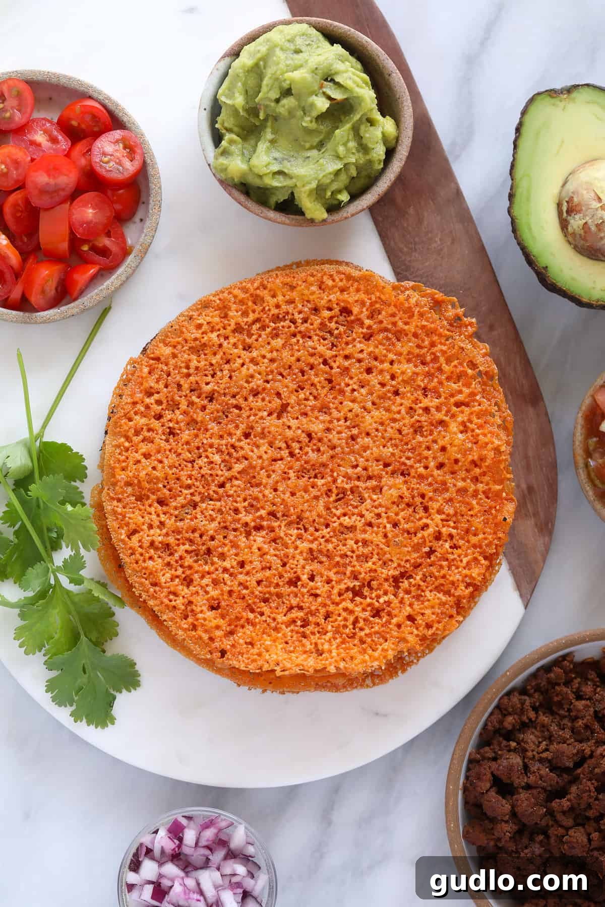 Low carb cheese tortillas on a plate, ready to be filled for quesadillas or tacos.