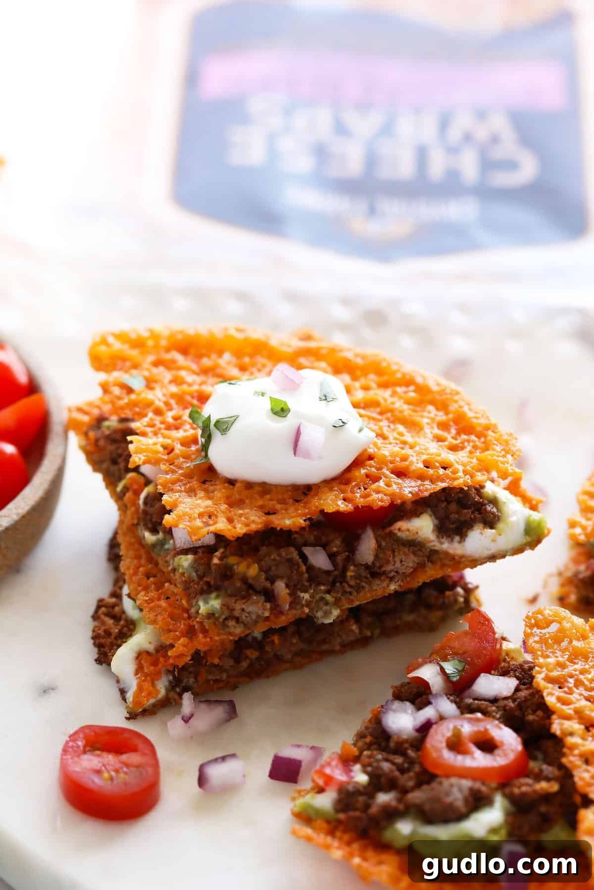 Two golden, crispy keto quesadillas stacked neatly, illustrating their crunchy texture and ease of preparation, promising a flavorful meal.