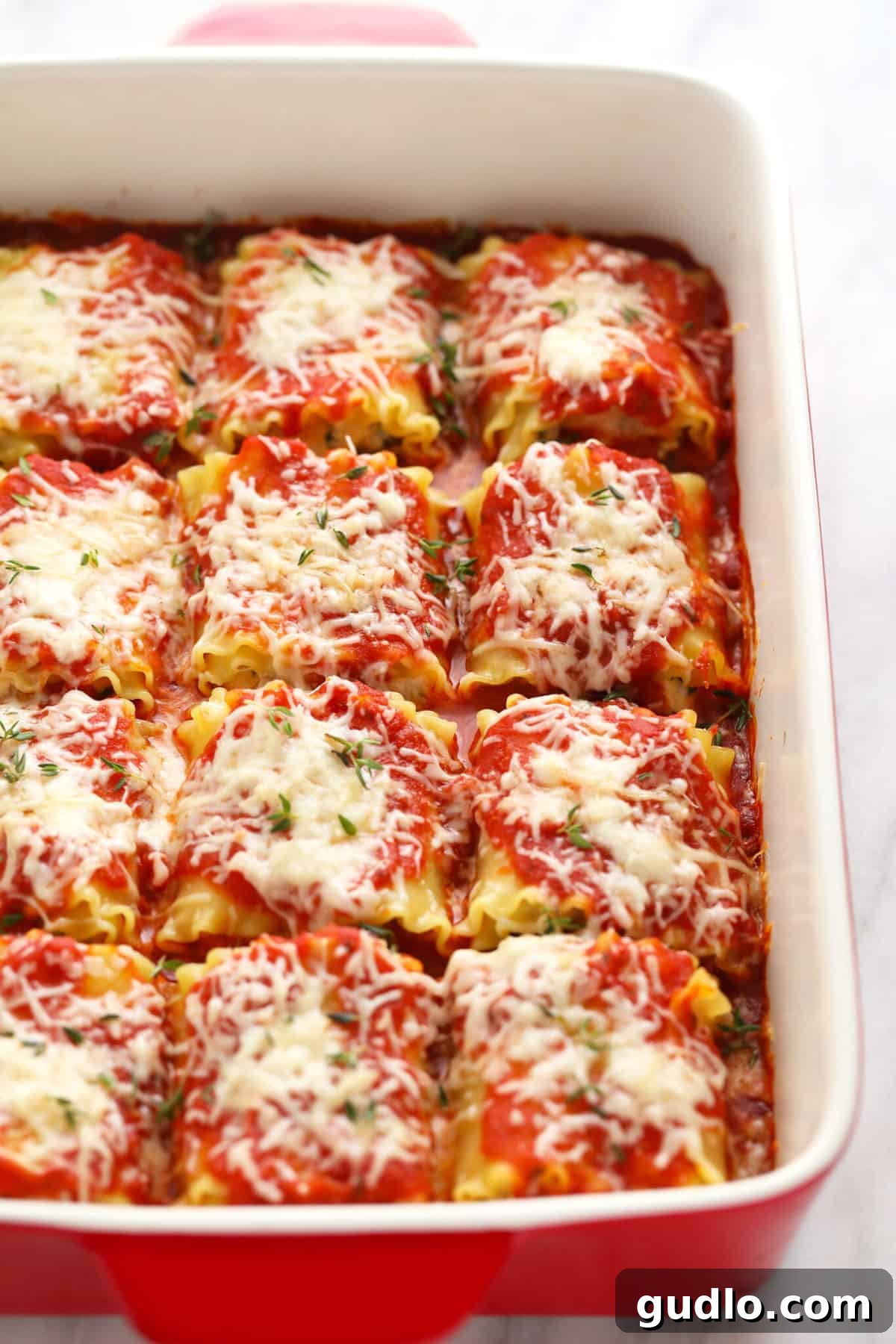 Wholesome Kale Lasagna Roll Ups 6 Perfectly baked Kale Lasagna Roll Ups, golden and bubbling with cheese in a casserole dish.