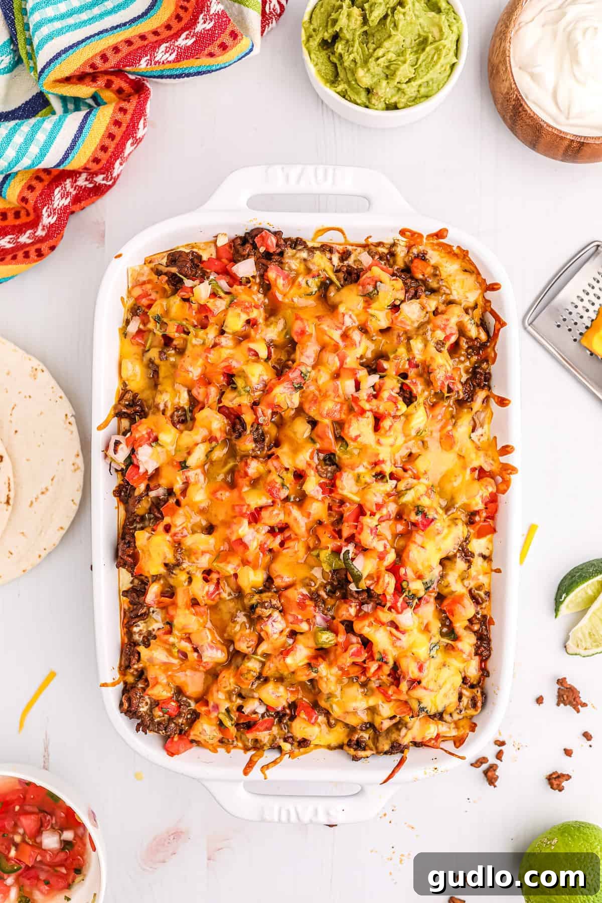 Tex-Mex Lasagna 2 A large casserole dish filled with baked Taco Lasagna, showing the golden-brown cheese topping and layers within.