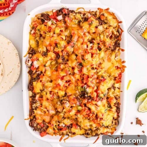 Tex-Mex Lasagna 12 Taco lasagna in a casserole dish, topped with melted cheese.