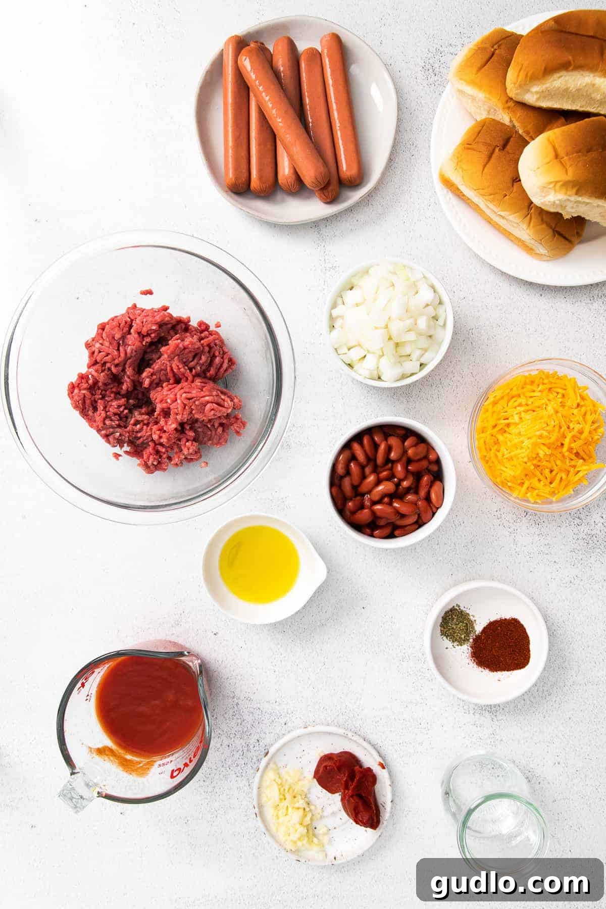 Assortment of fresh ingredients laid out on a countertop, ready for chili preparation.