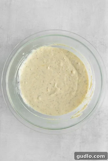 A bowl filled with the creamy cheese mixture: ricotta, mozzarella, and parmesan, ready for the lasagna layers.