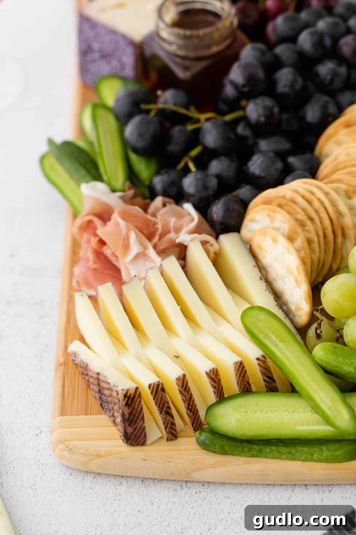 The Heart of the Board: A Delicious Cheese Selection A close-up view of a selection of cheeses on a cutting board, highlighting their distinct textures and colors, ready to be served.