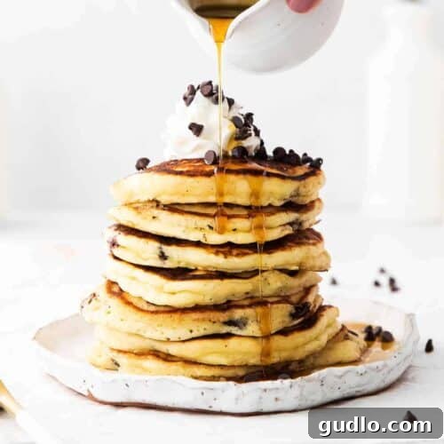 A perfectly golden stack of chocolate chip ricotta pancakes, ready to be served.