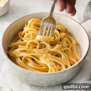 Shortcut Cream Cheese Alfredo Sauce 2 Homemade alfredo sauce over pasta in a bowl.