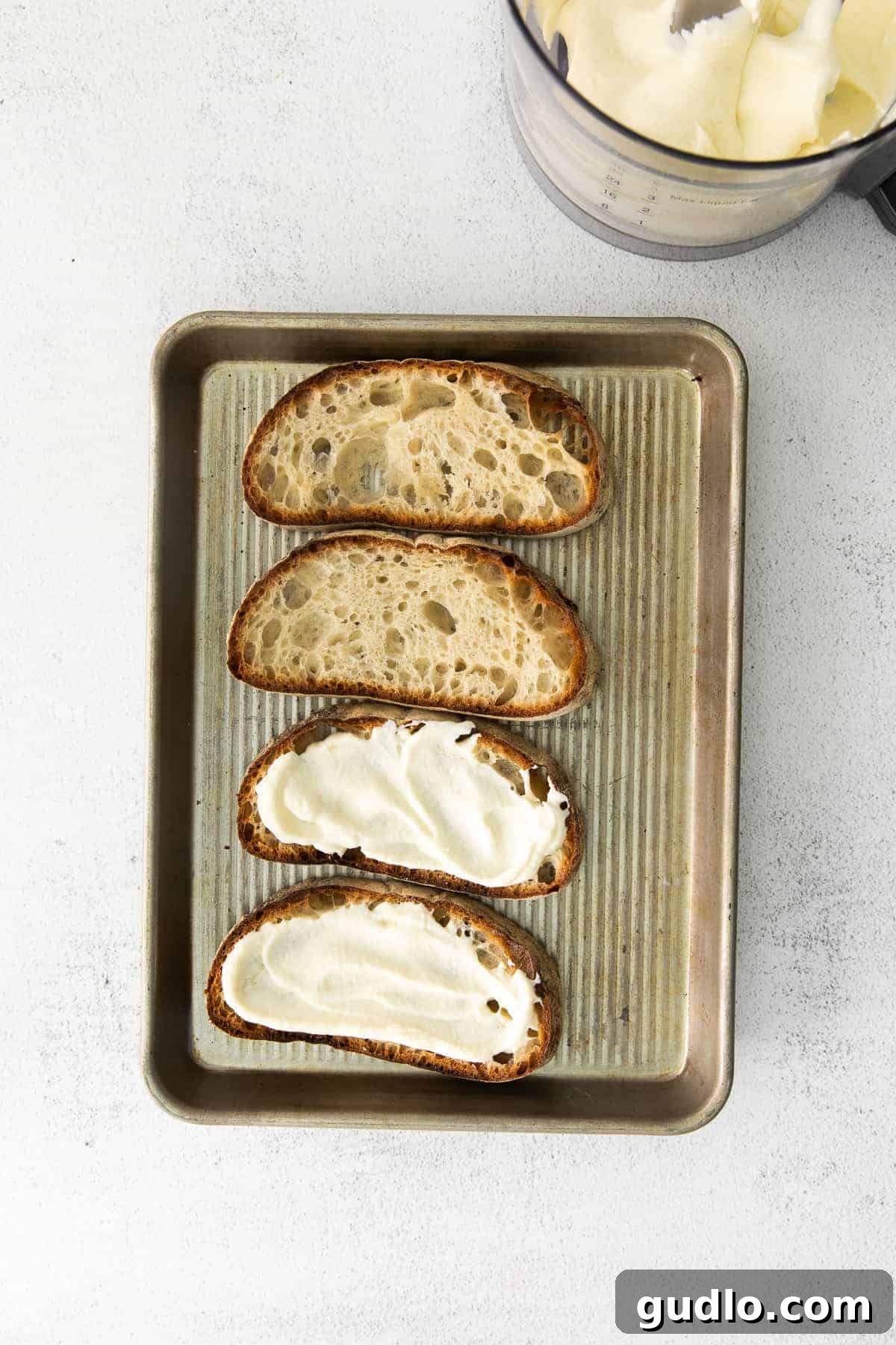 Ricotta Toast: Sweet and Savory Delights 6 Ricotta toast on a baking sheet topped with ricotta cheese.