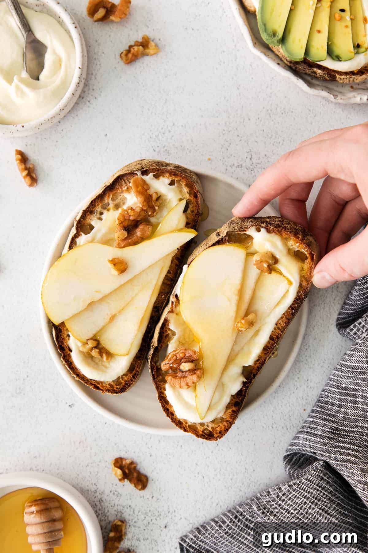 Ricotta Toast: Sweet and Savory Delights 8 Ricotta toast topped with pears and walnuts.