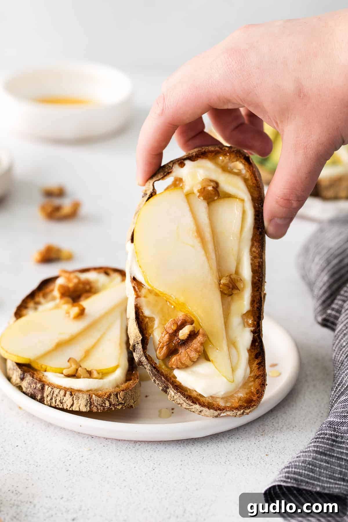 Ricotta Toast: Sweet and Savory Delights 9 Ricotta toast topped with honey, pears, and walnuts.
