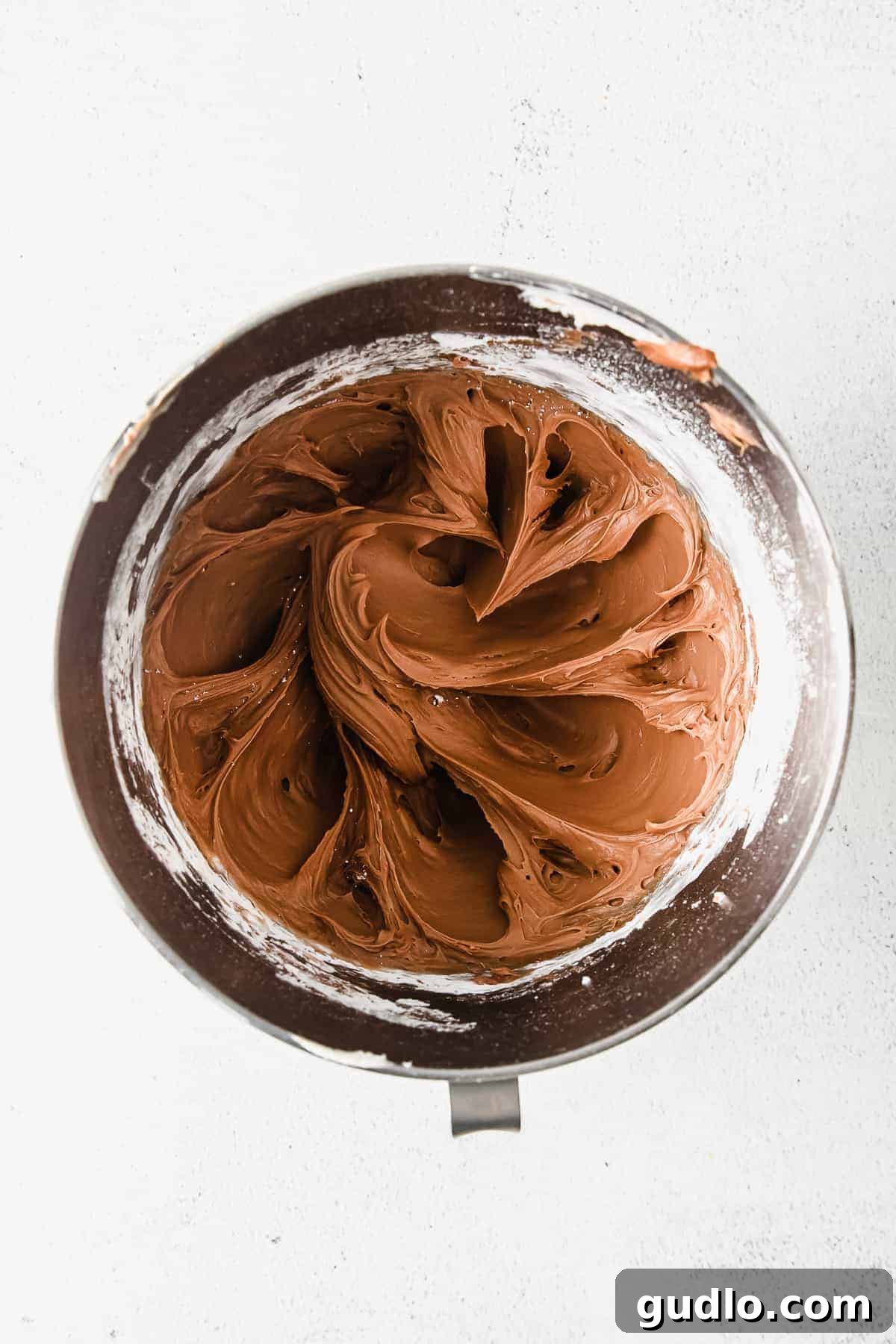 Velvety Chocolate Cream Cheese Delight 4 Thick, creamy, and stable chocolate cream cheese frosting piled high in a mixing bowl. This thick and creamy chocolate cream cheese frosting is perfect for cakes and cupcakes.