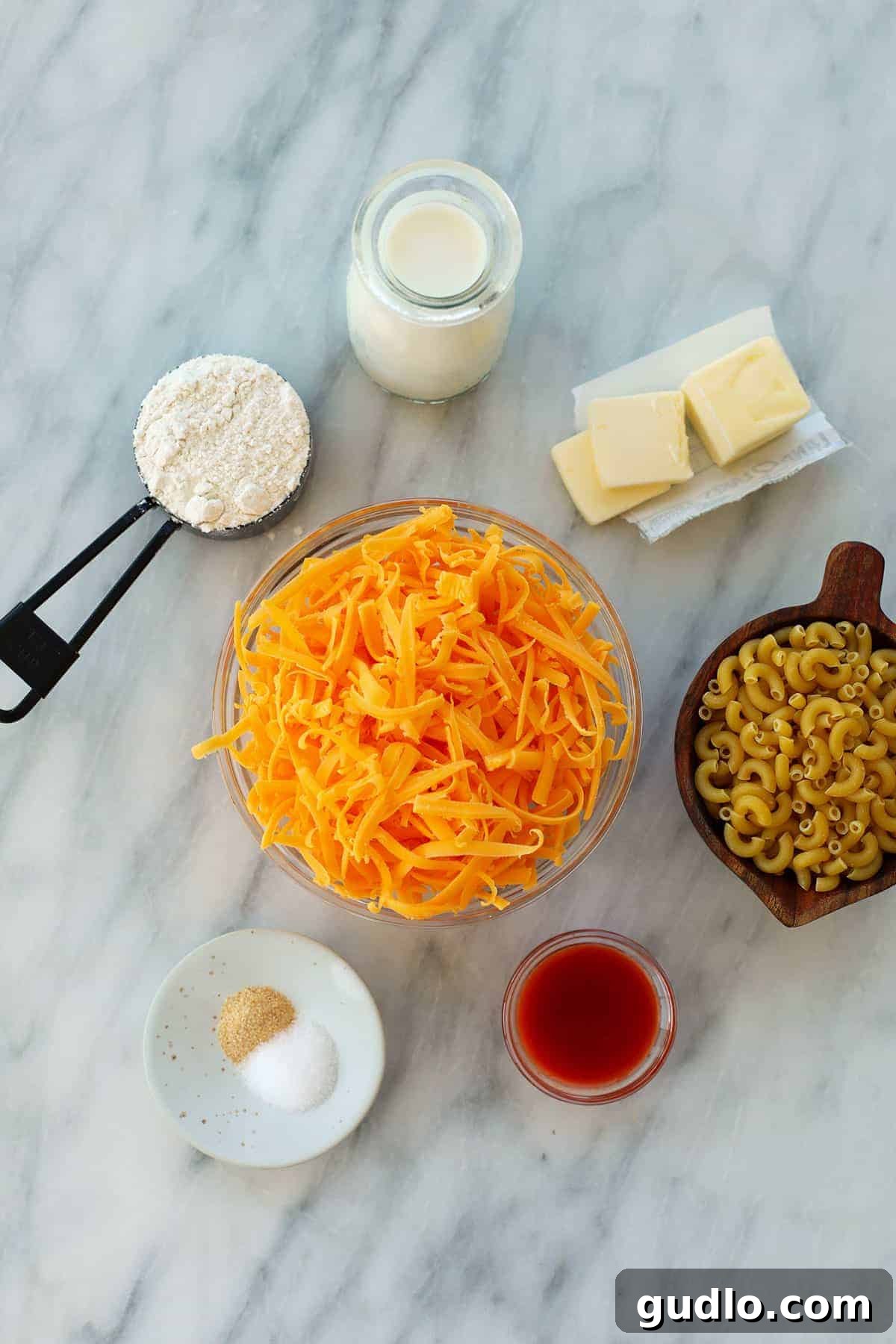 All the simple ingredients you need for this smoky, cheesy delight. Smoked mac and cheese ingredients in bowls.