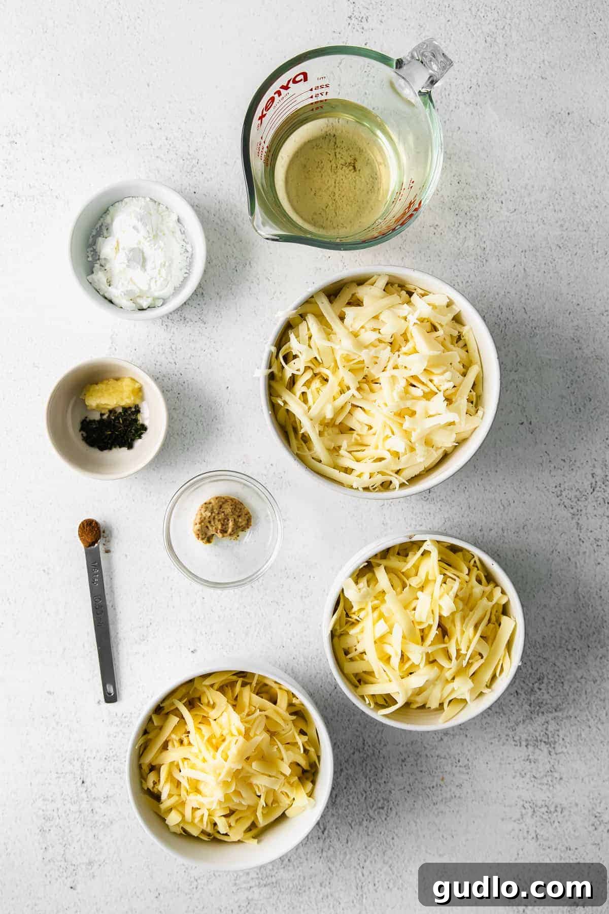 Individual fondue ingredients laid out in small bowls, ready for preparation.