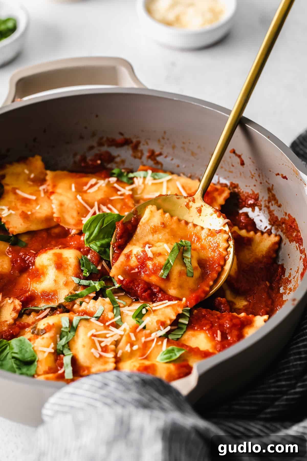 A skillet of homemade cheese ravioli, ready to be served.