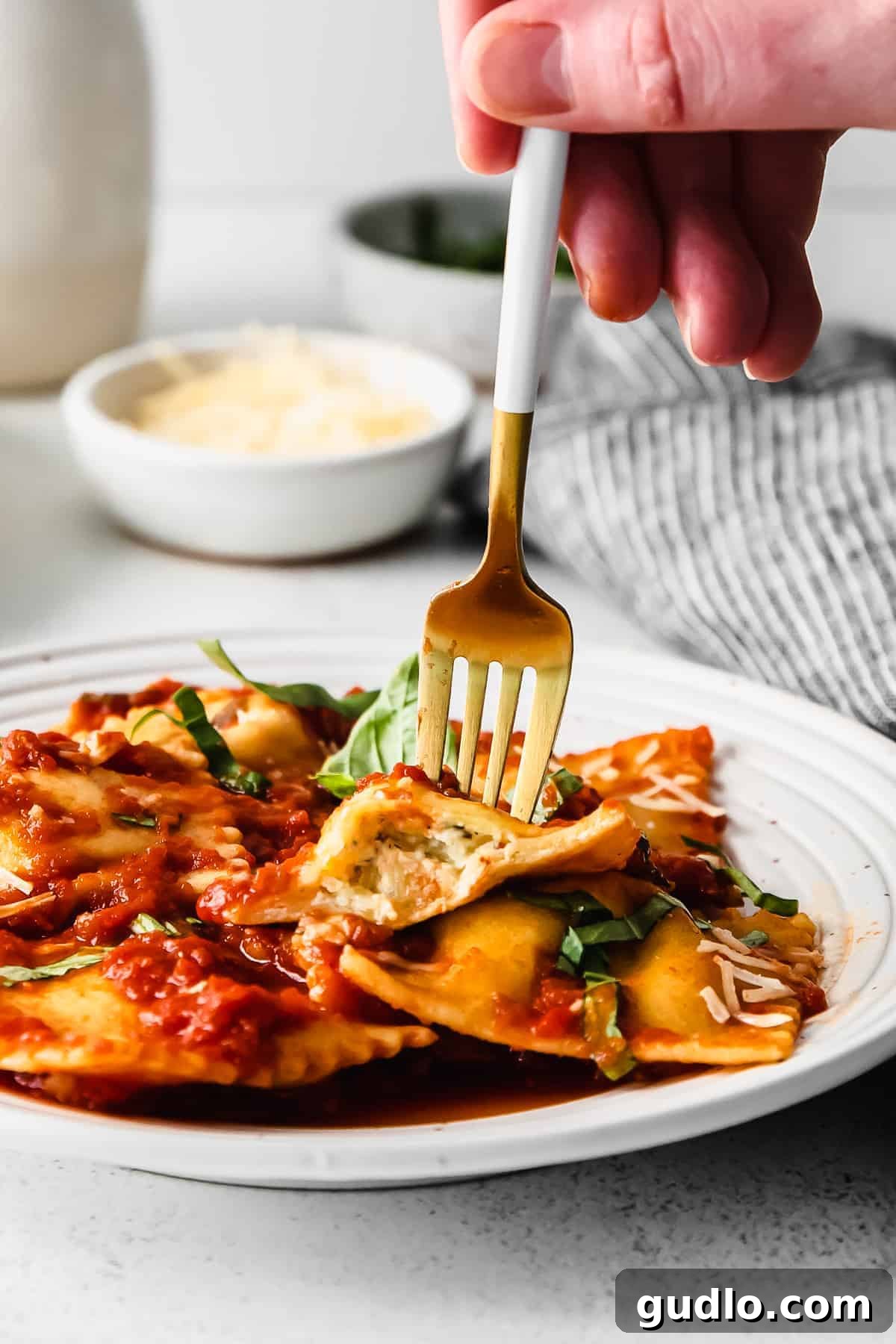 A beautiful plate of homemade cheese ravioli, ready to eat.