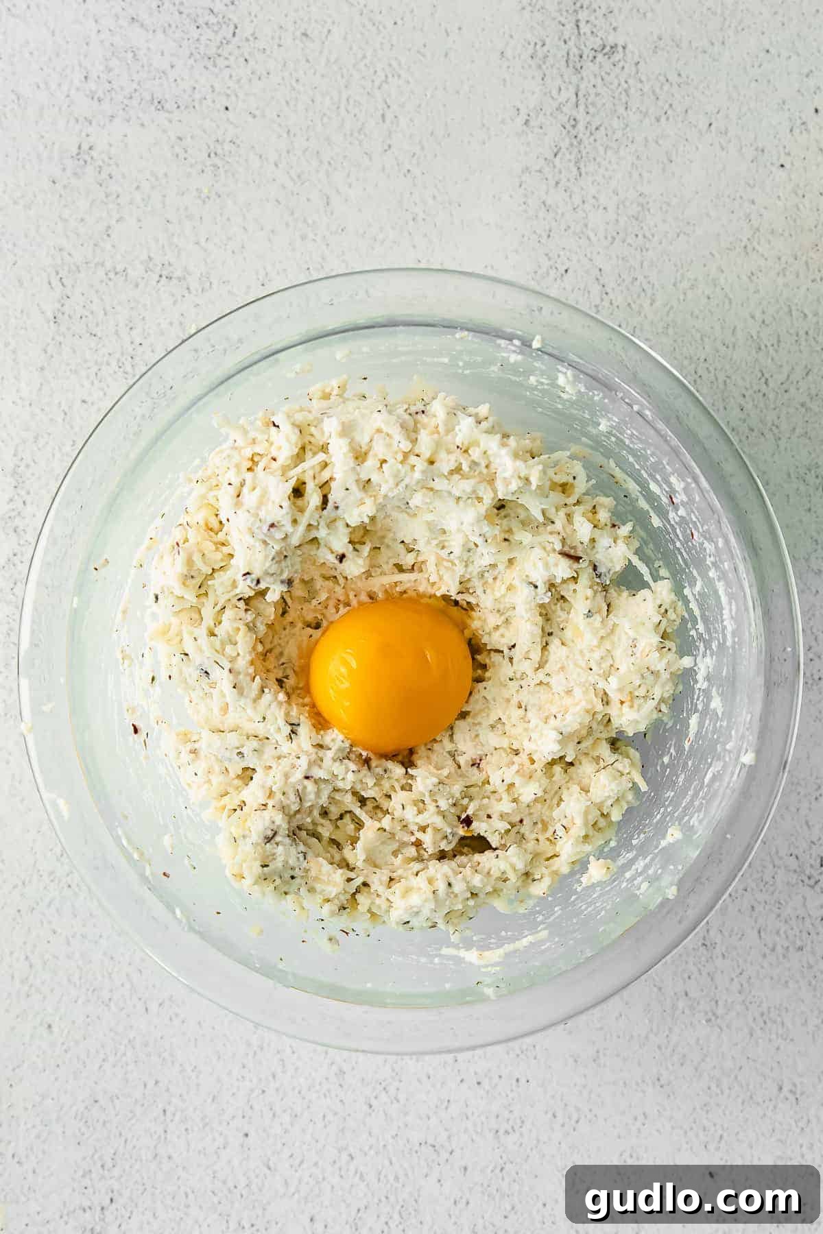 A bowl of creamy homemade cheese ravioli filling.