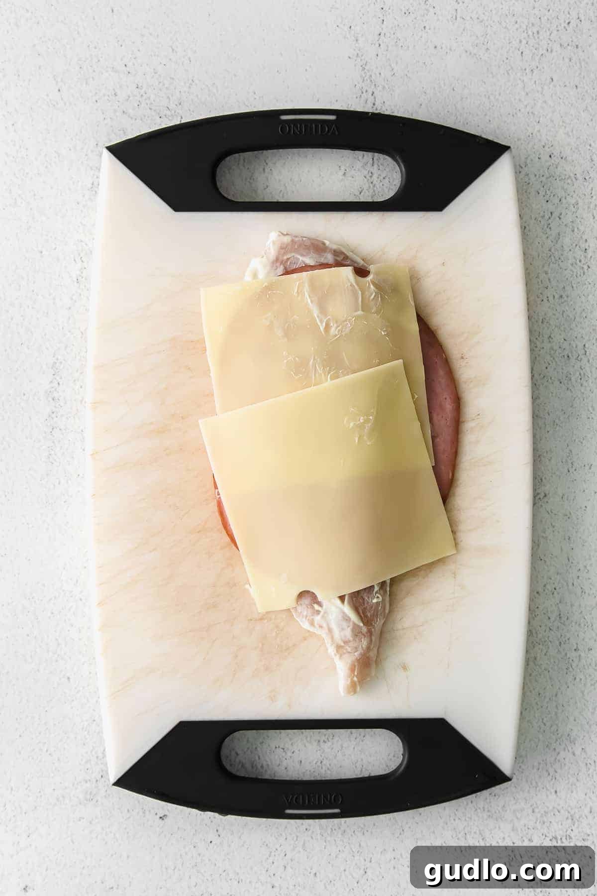 Assembling the Perfect Chicken Cordon Bleu chicken cordon bleu being assembled on a cutting board