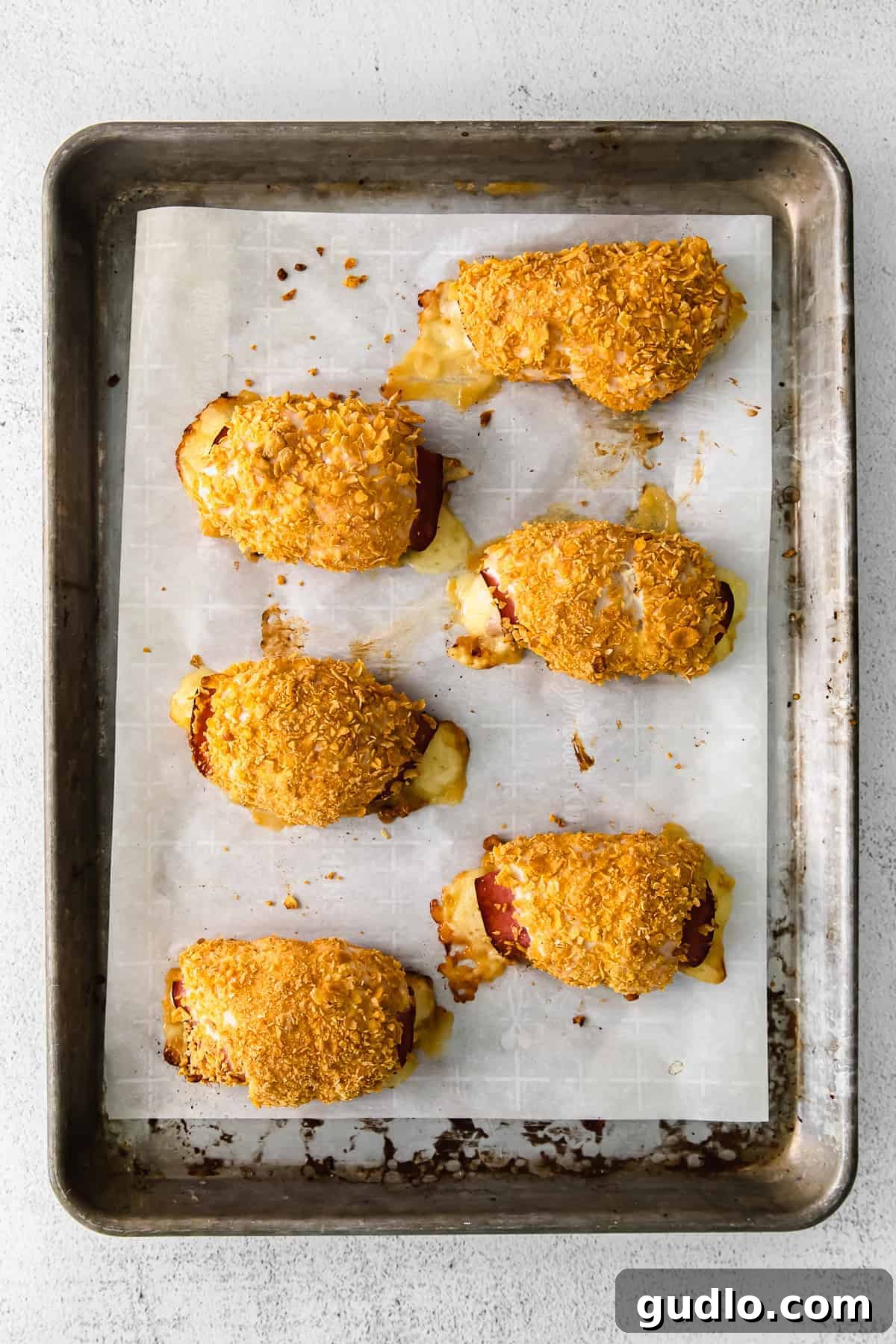 Chicken Cordon Bleu Ready for the Oven chicken cordon bleu assembled on a baking sheet
