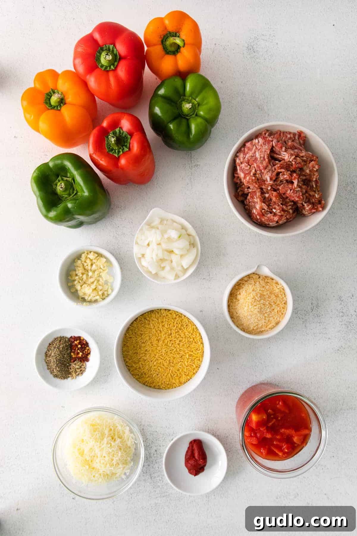 A selection of fresh ingredients laid out on a kitchen counter, ready for preparing Italian Stuffed Peppers.