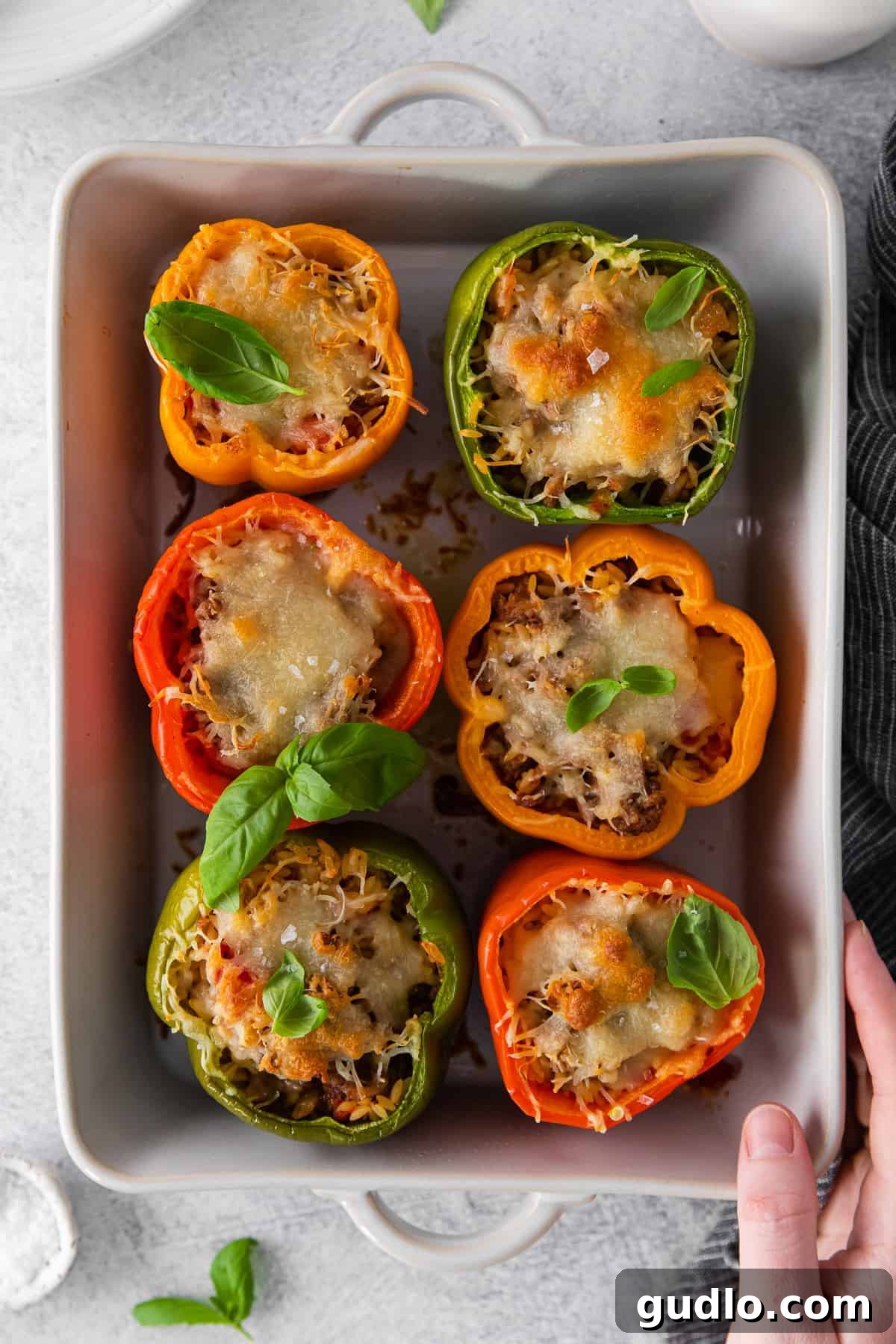 A close-up of a beautifully baked Italian Stuffed Pepper, ready to be served from the casserole dish.