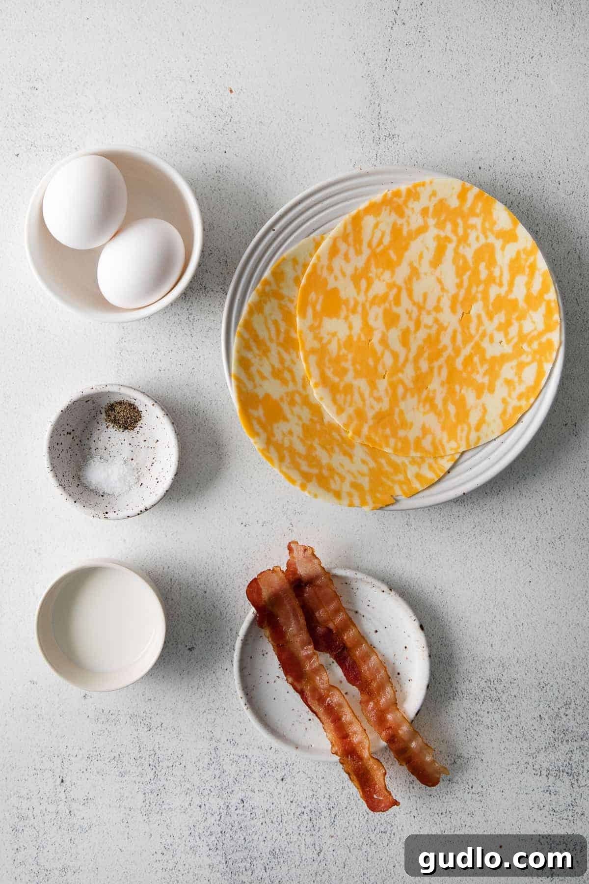 Ingredients for Crispy Cheese Wrap Breakfast Taquitos A vibrant flat lay of all the fresh ingredients needed for making delicious bacon and egg breakfast taquitos, including large eggs, a bottle of milk, Crystal Farms cheese wraps, cooked bacon strips, and seasoning shakers.