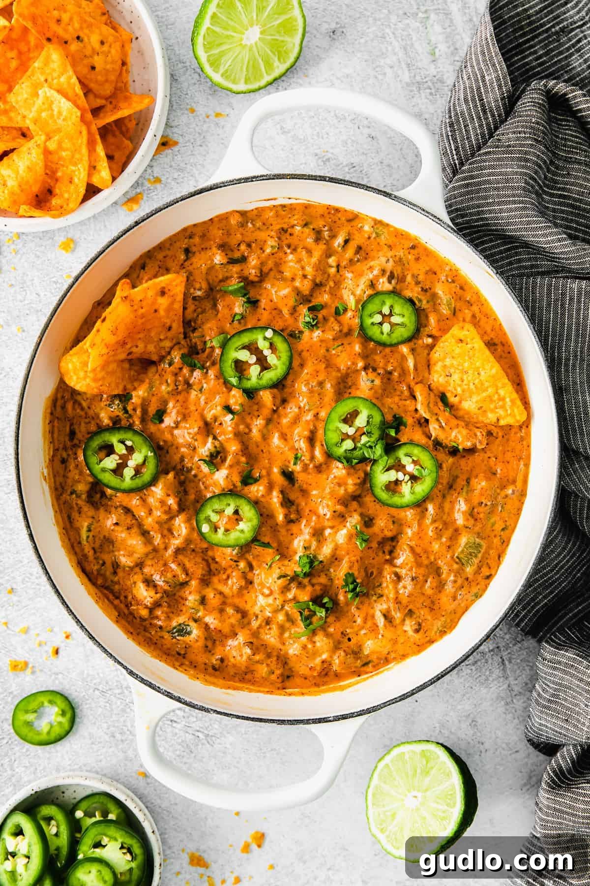 Oven-Baked Cheesy Jalapeño Dip 2 Rich and creamy Jalapeño Popper Dip generously topped with fresh jalapeño slices, ready to be scooped.