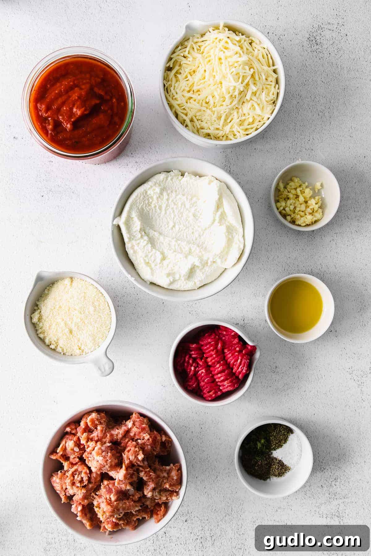 Skillet Lasagna Bake 3 Assortment of fresh ingredients for lasagna dip laid out on a kitchen countertop