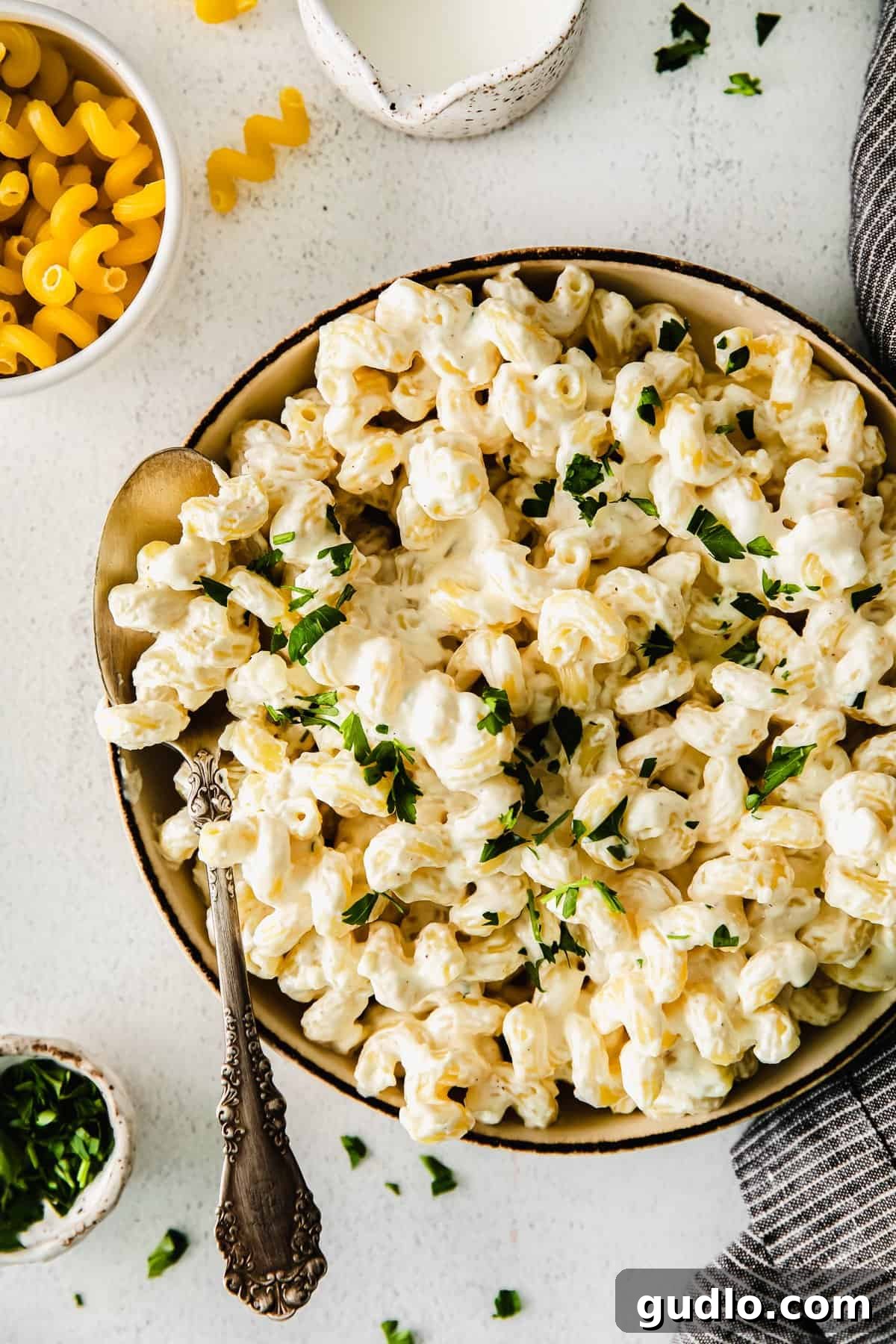 A bowl of creamy cream cheese pasta, garnished and ready to serve.